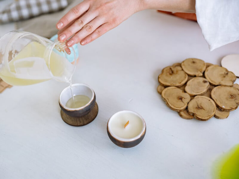 A woman making a soy candle.